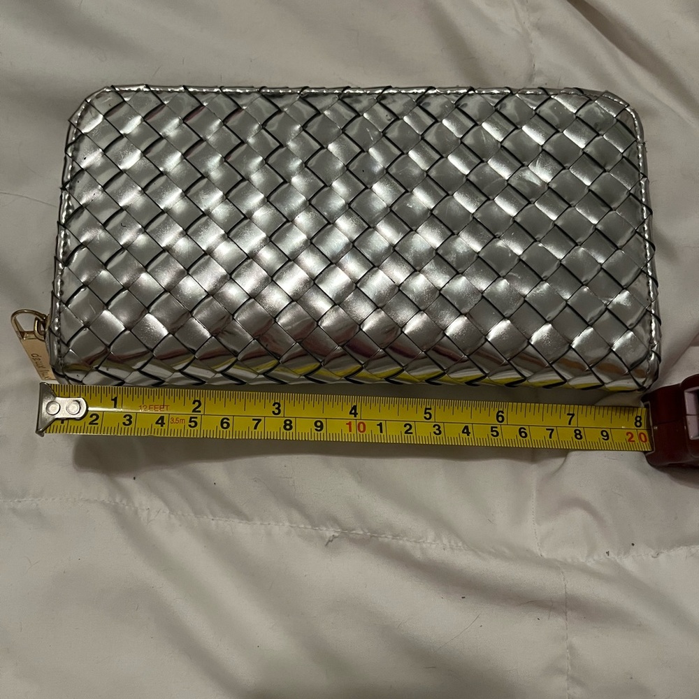 Women’s woven  wallet/clutch. Chrome. Excellent condition